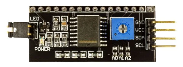 I2C LCD IO Expander (PCF8574) module board for interfacing PIC16F877 with I2C 16x2 LCD, featuring a 16-pin header and adjustable backlight.